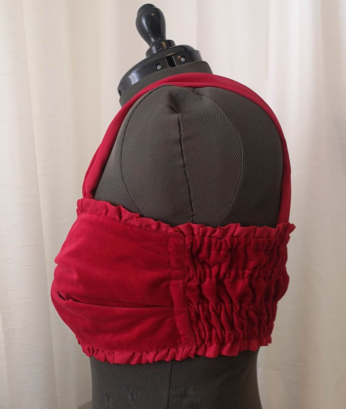 Side view of red velvet bow top