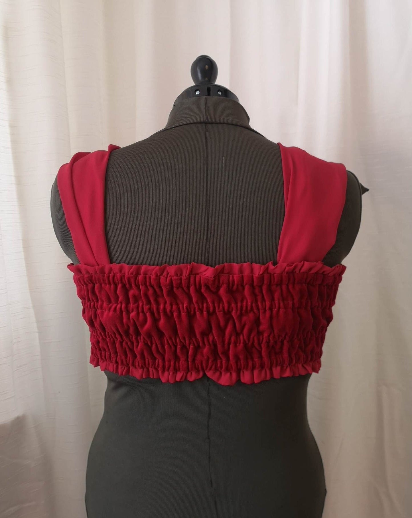 Back view of red velvet bow top